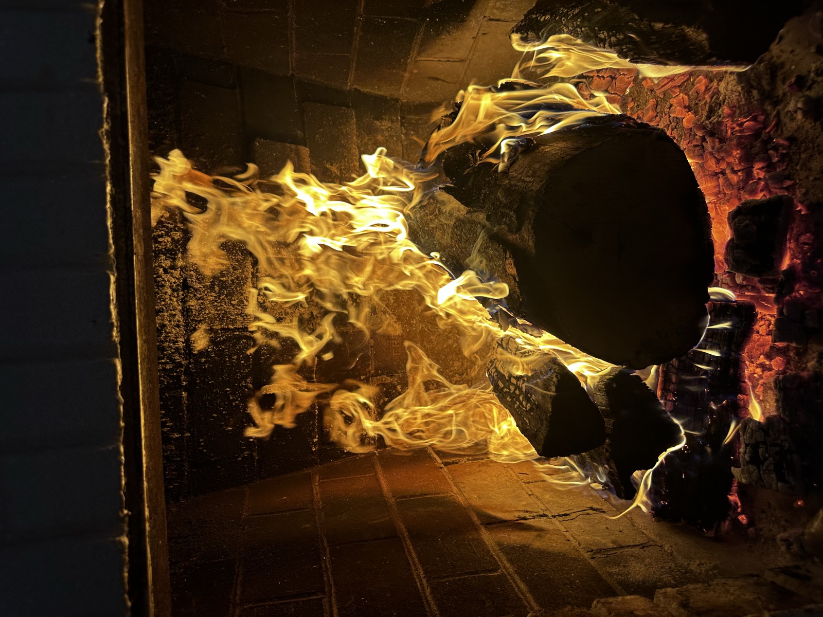 Seasoned firewood burning in a wood stove